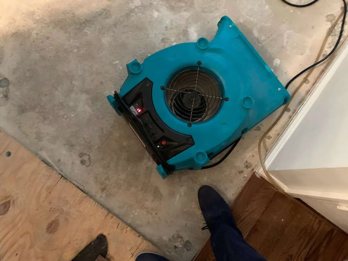 Air mover drying subfloor during Leak Detection & Repair in Powder Springs