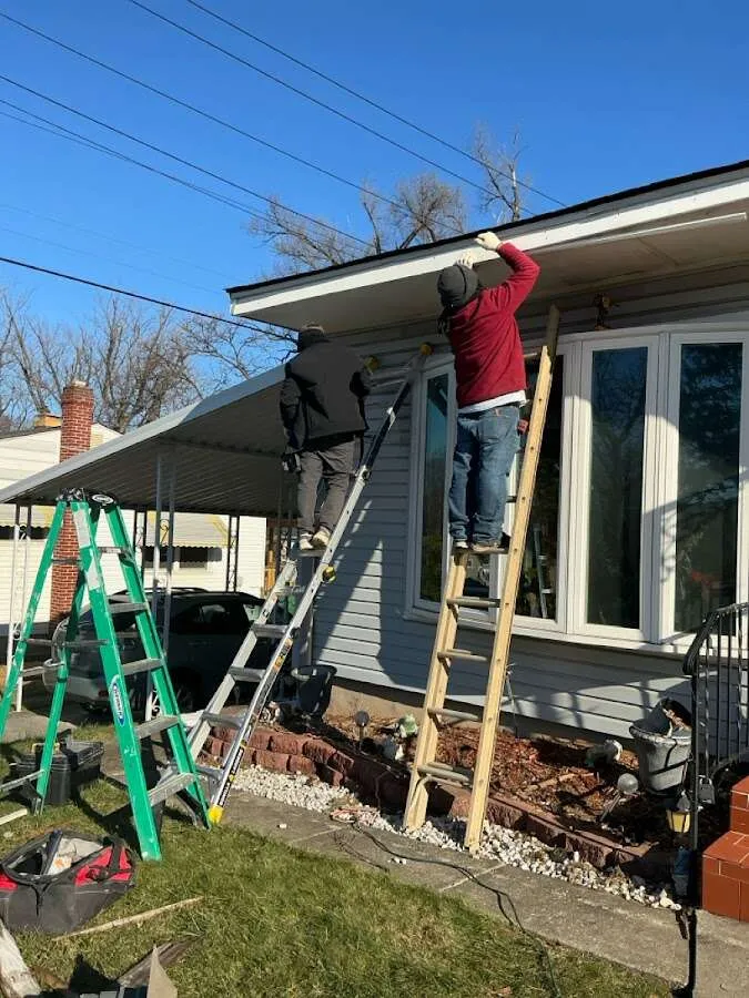 Restoration crew performing exterior repair in Powder Springs